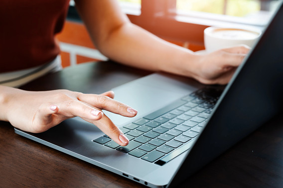 Hands on laptop keyboard